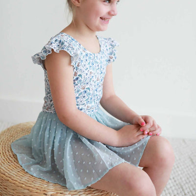 white leotard with blue florals and swiss dot skirt 