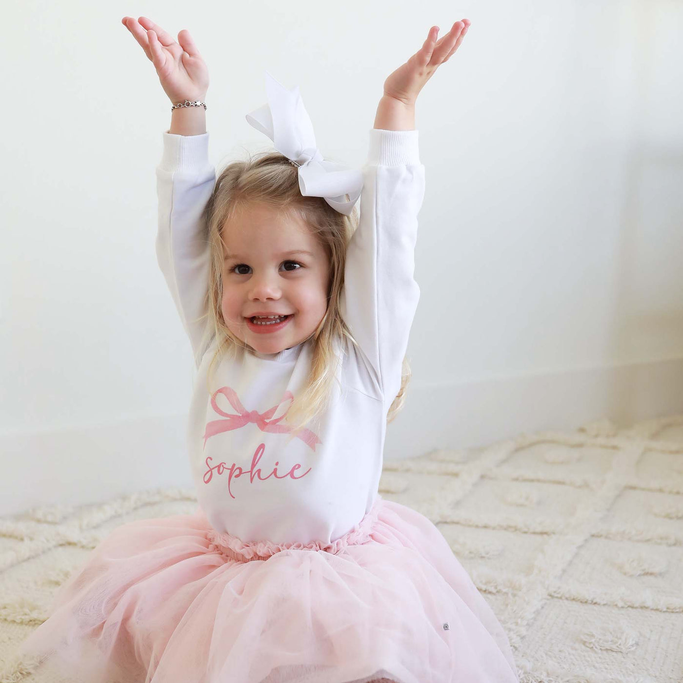 white sweatshirt for kids with pink bow personalized with name 