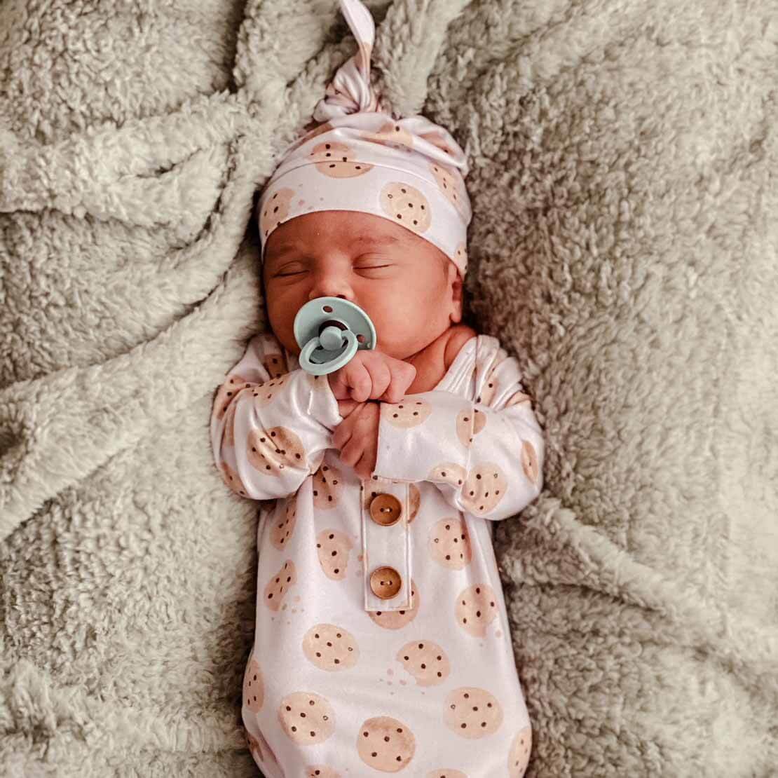 newborn gown printed with cookies and matching hat 