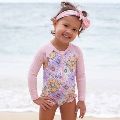 long sleeve rash guard swimsuit for girls with ruffles on the leg pastel floral 