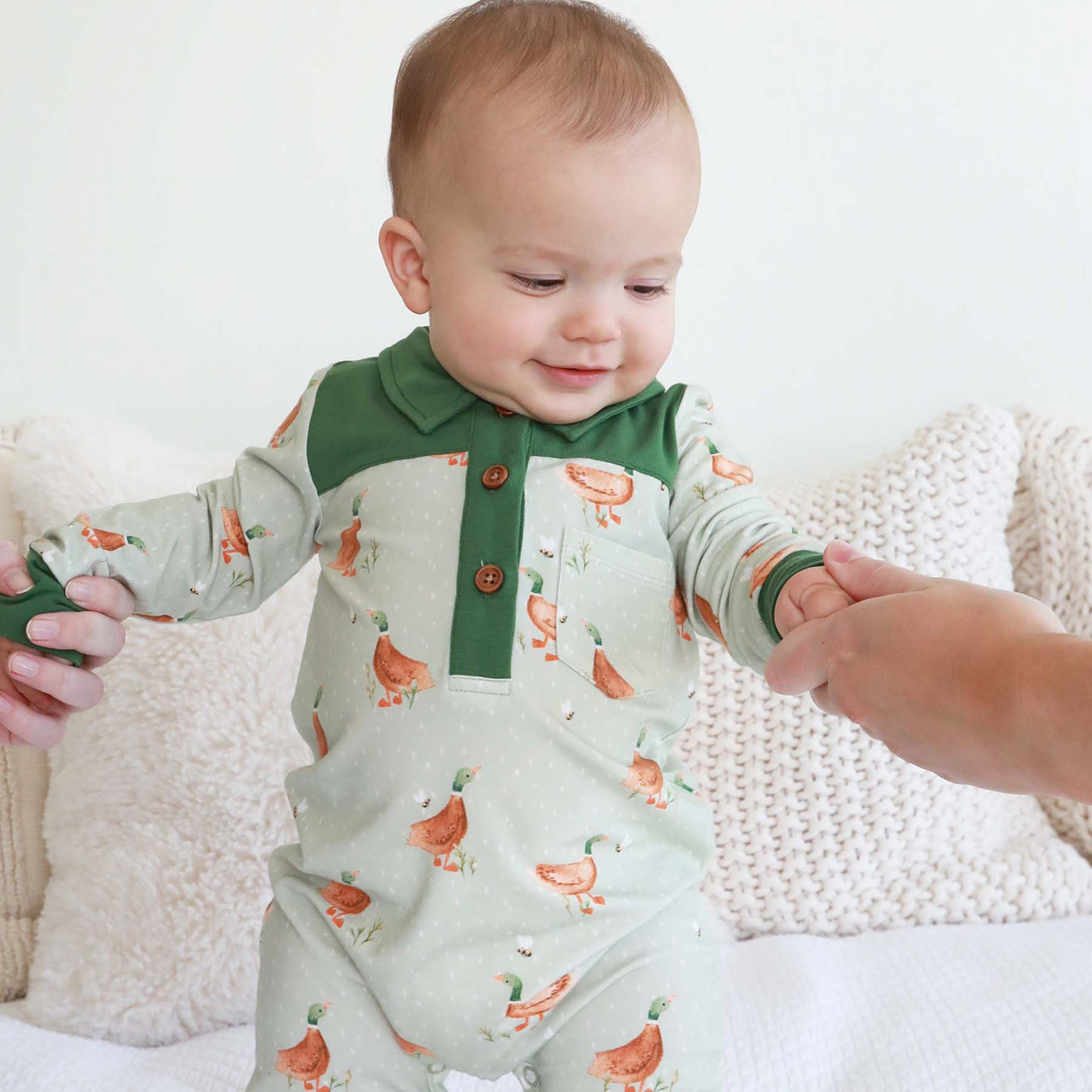green romper for babies with ducks 