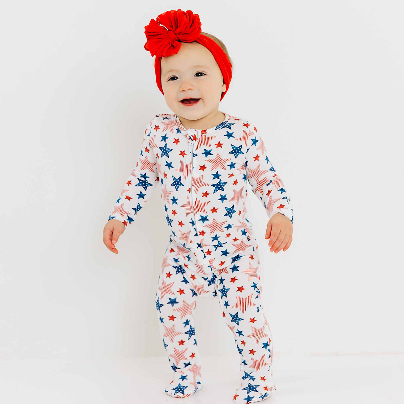 fourth of july zipper footie pajamas for babies with red, white and blue stars 