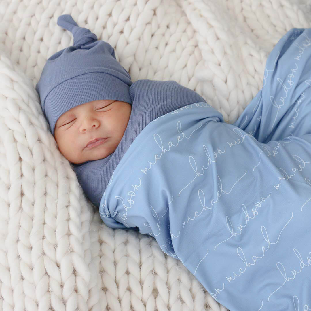 Wrapping a baby in a online blanket