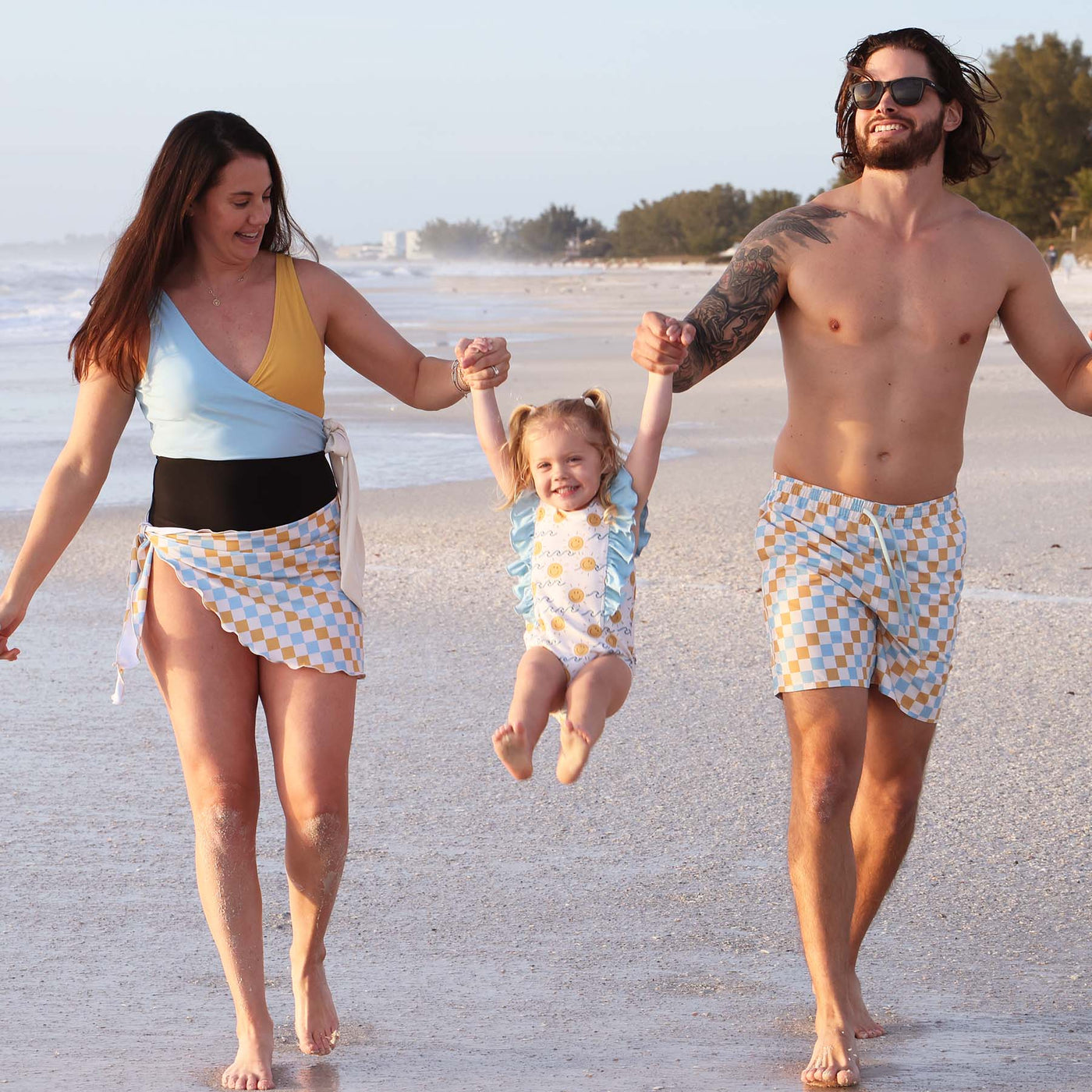 matching family swimsuits blue and yellow checkered print 