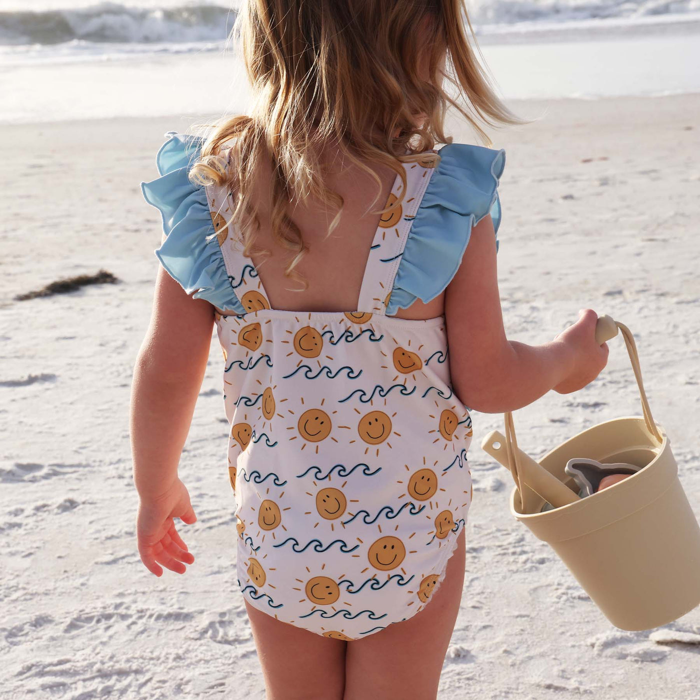 ruffle shoulder swimsuit for kids with waves and suns