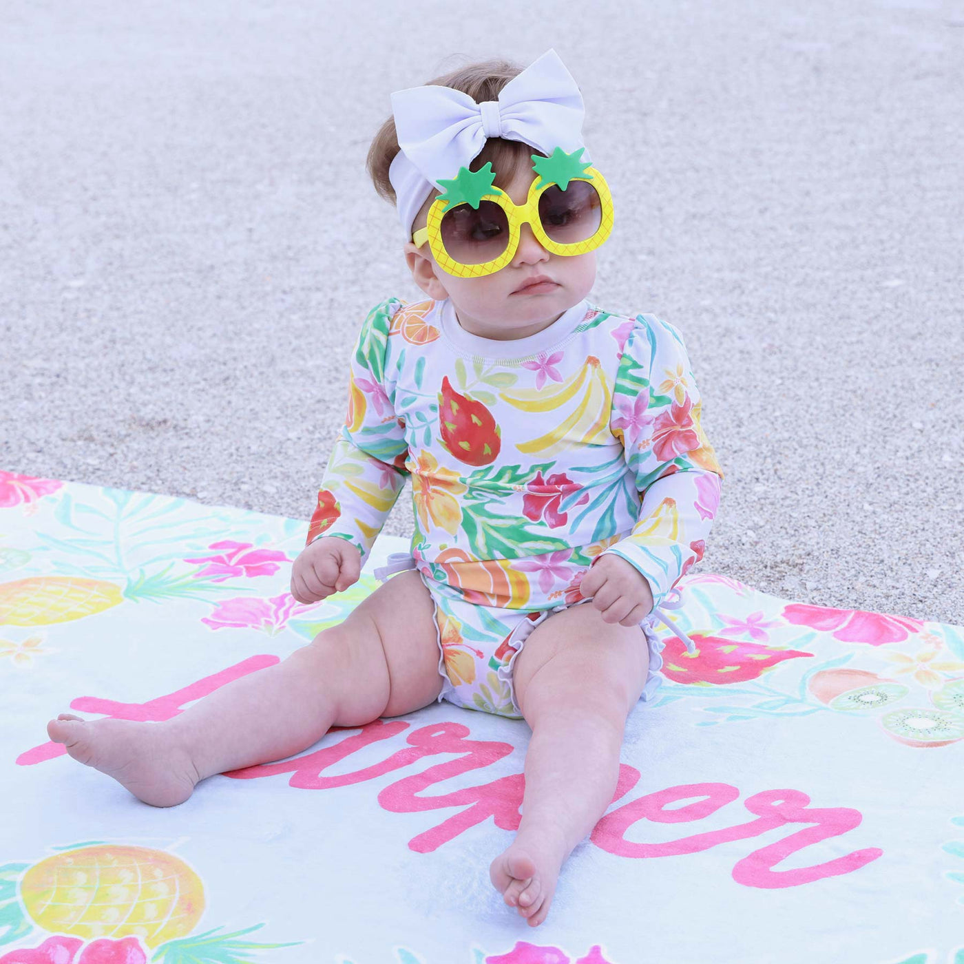 long sleeve rash guard swimsuit for babies that matches with the whole family and is fruit themed