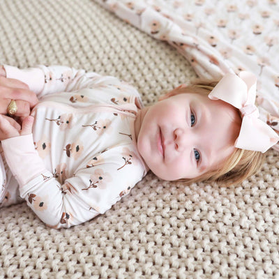 convertible romper pajamas for toddler with muted flowers 