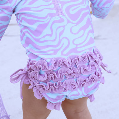 ruffle bottom rash guard for babies with long sleeves blue and purple 