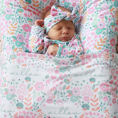 pink and green floral swaddle blanket with name for baby 