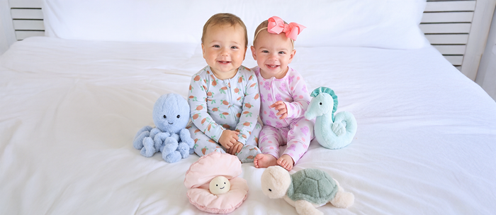 Babies wearing Caden Lane summer bamboo pajamas