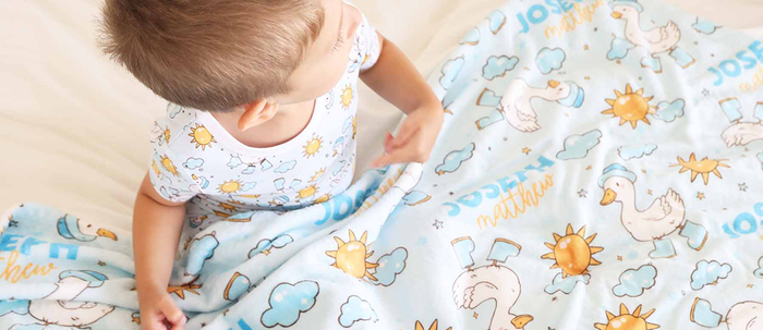 baby toddler boy with Caden Lane goose print toddler blanket