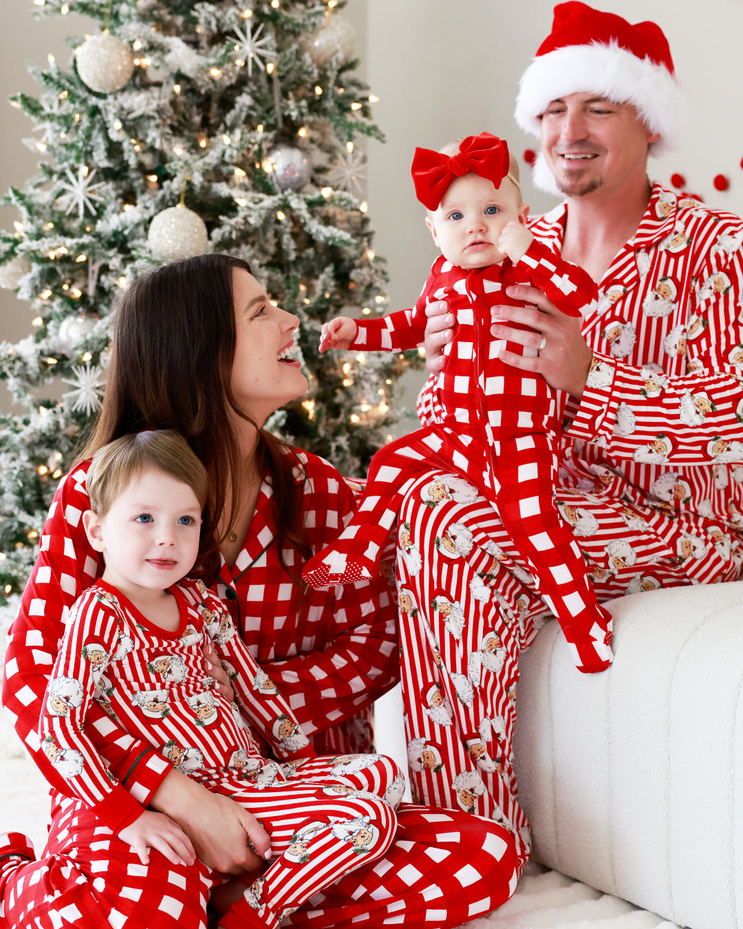family wearing matching Santa Claus Lane pajamas