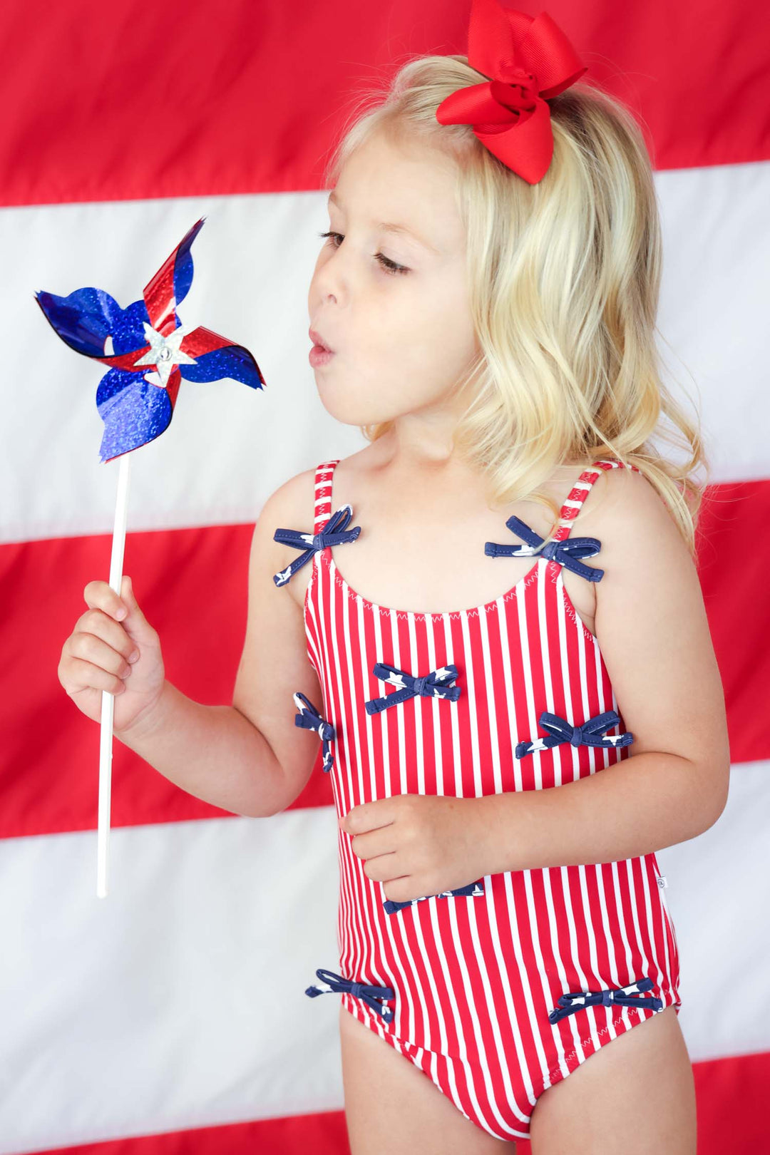 Stars & Stripes Party baby girl one piece swimsuit with tiny bows view 8 | 4th of July swim | Caden Lane