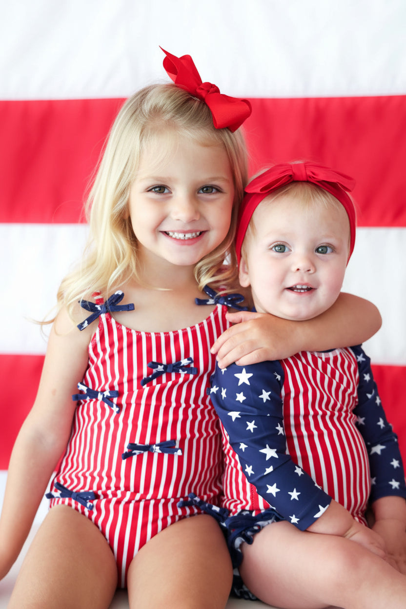 Stars & Stripes Party baby girl one piece swimsuit with tiny bows view 9 | 4th of July swim | Caden Lane