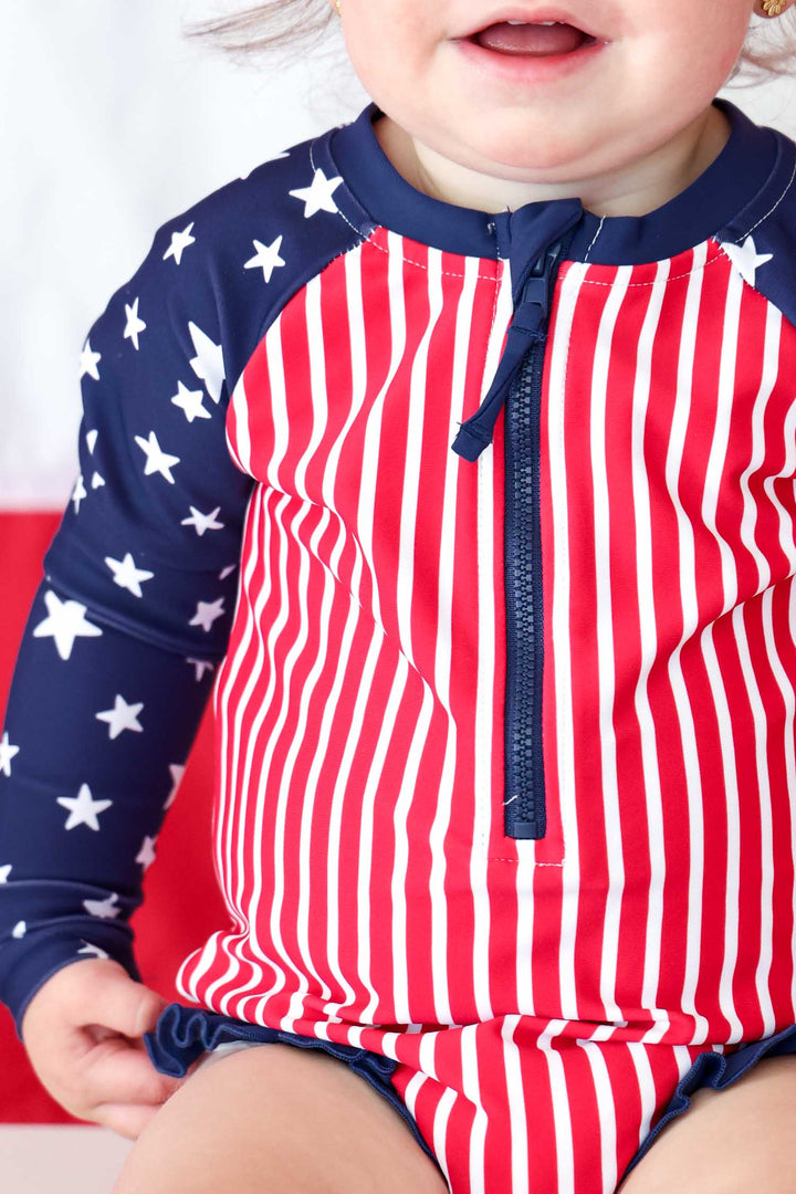 Stars & Stripes Party kids long sleeve rash guard with front zipper detail view 11 | 4th of July kids swim | Caden Lane