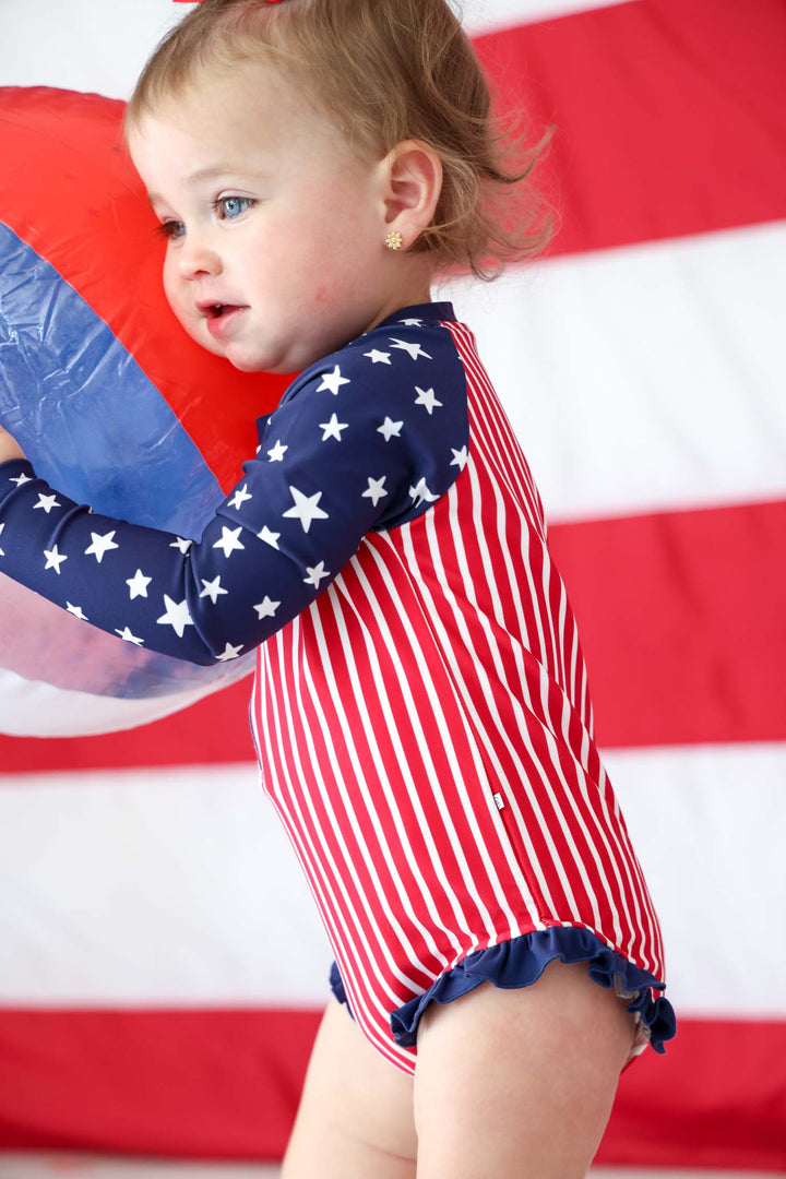 Stars & Stripes Party kids long sleeve rash guard with front zipper detail view 14 | 4th of July kids swim | Caden Lane