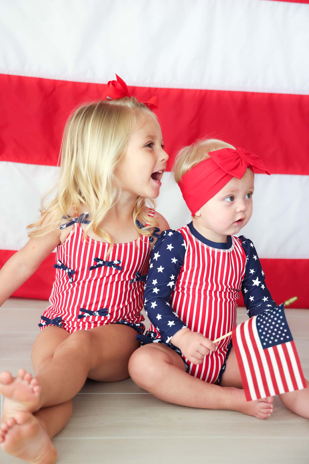 Stars & Stripes Party baby girl one piece swimsuit with tiny bows view 11 | 4th of July swim | Caden Lane