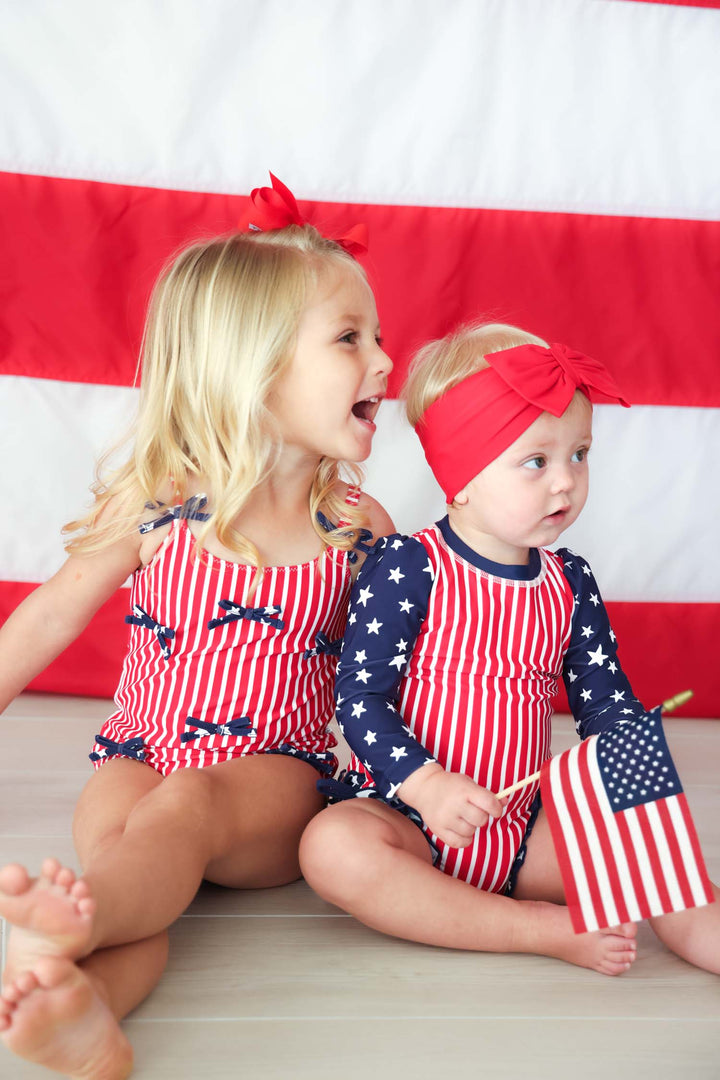 Stars & Stripes Party baby girl one piece swimsuit with tiny bows view 11 | 4th of July swim | Caden Lane