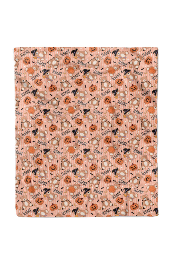 Caden Lane Halloween-themed fabric with pumpkins, ghosts, and witches' hats on an orange background