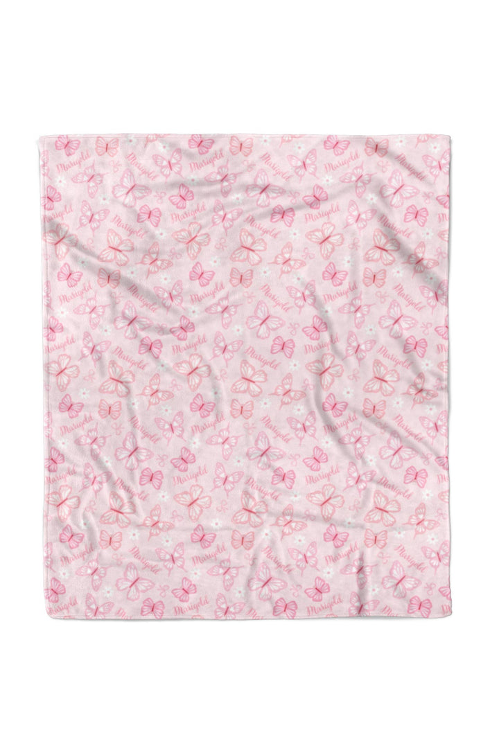 Personalized Kids Blanket in Blooming Butterflies print - 50x60 inch blanket shown folded flat, revealing detailed pink butterfly print with name pattern on soft fabric
