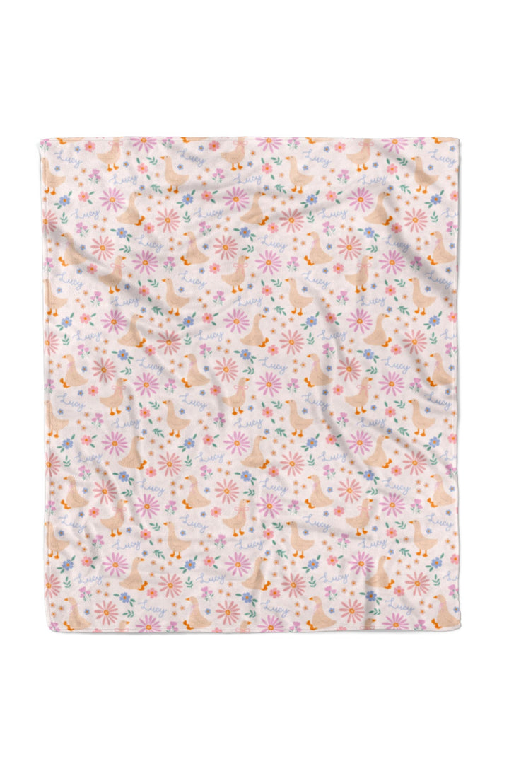 Lucy Goosy Personalized Kids Blanket laid flat showing the full duck and floral print pattern on a white background, 50x60 inches