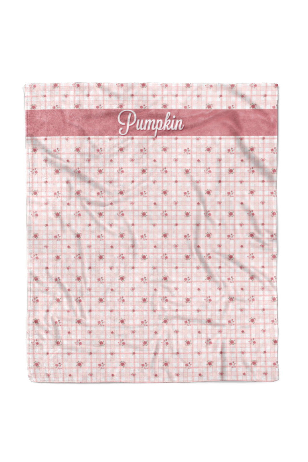 Caden Lane personalized pet blanket in pink Primrose Plaid print with a small floral pattern, featuring a rose pink "Pumpkin" name banner near the top edge.