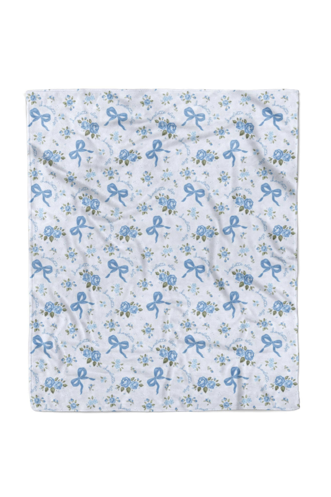 Flat lay of the 50x60 Tied In Blooms blanket fabric showing the blue floral and bow print pattern