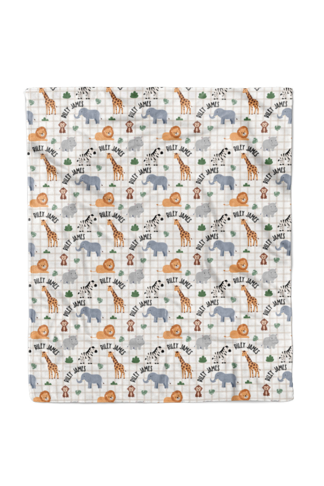 Flat lay of a Caden Lane personalized 50x60 plush blanket in a Wild Child print featuring safari animals on cream plaid, with arched name text reading "Riley James."