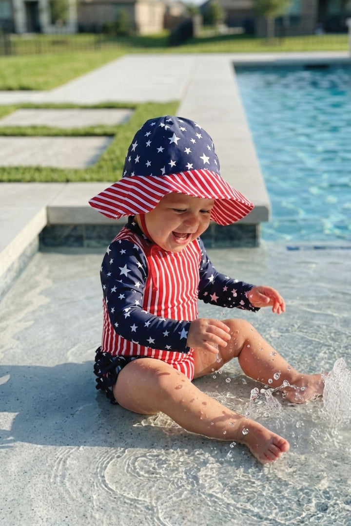 Stars & Stripes Party baby girl rash guard with ruffle bottom detail view 9 | 4th of July kids swim | Caden Lane