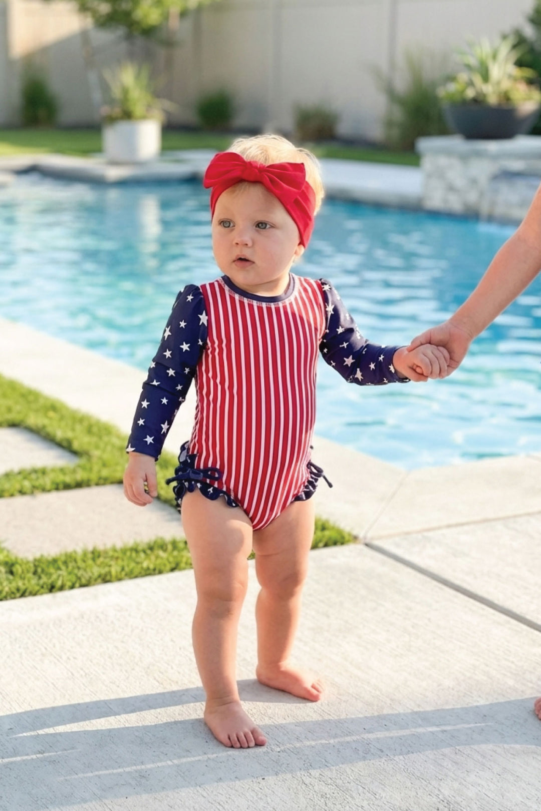 Stars & Stripes Party baby girl rash guard with ruffle bottom detail view 13 | 4th of July kids swim | Caden Lane