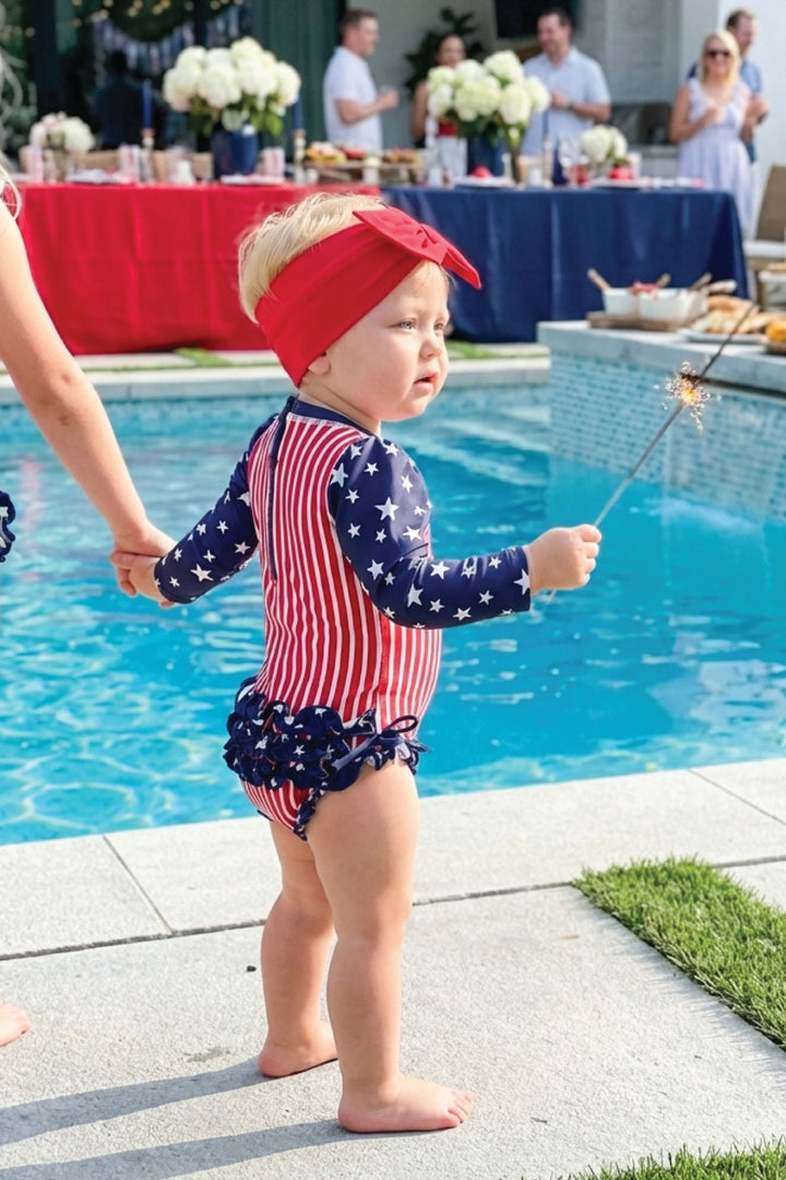 Stars & Stripes Party baby girl rash guard with ruffle bottom detail view 11 | 4th of July kids swim | Caden Lane