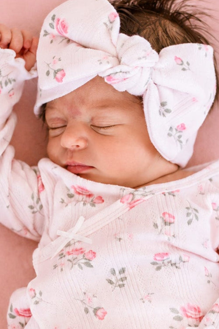Caden Lane Rose Garden newborn hospital outfit, sleeping baby in white floral gown and matching bow hat