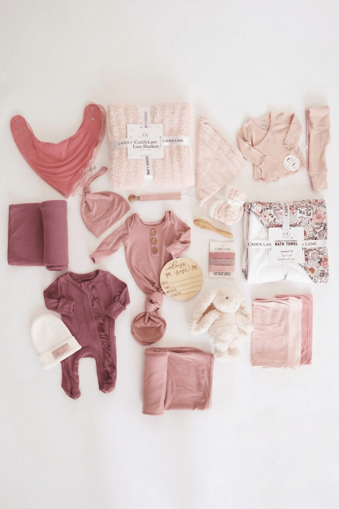 deluxe baby shower gift box bundle with pink 2pc waffle, zipper footie, knot gown, wood  stats, swaddles, bottle labels, burps, socks, paci clip, beanie, lovey, blanket, hooded towel, hair brush, bunny stuffed animal