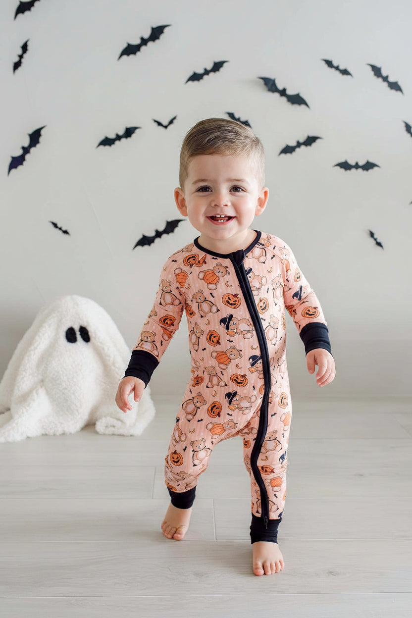 smiling boy in beary scary halloween convertible zip romper 