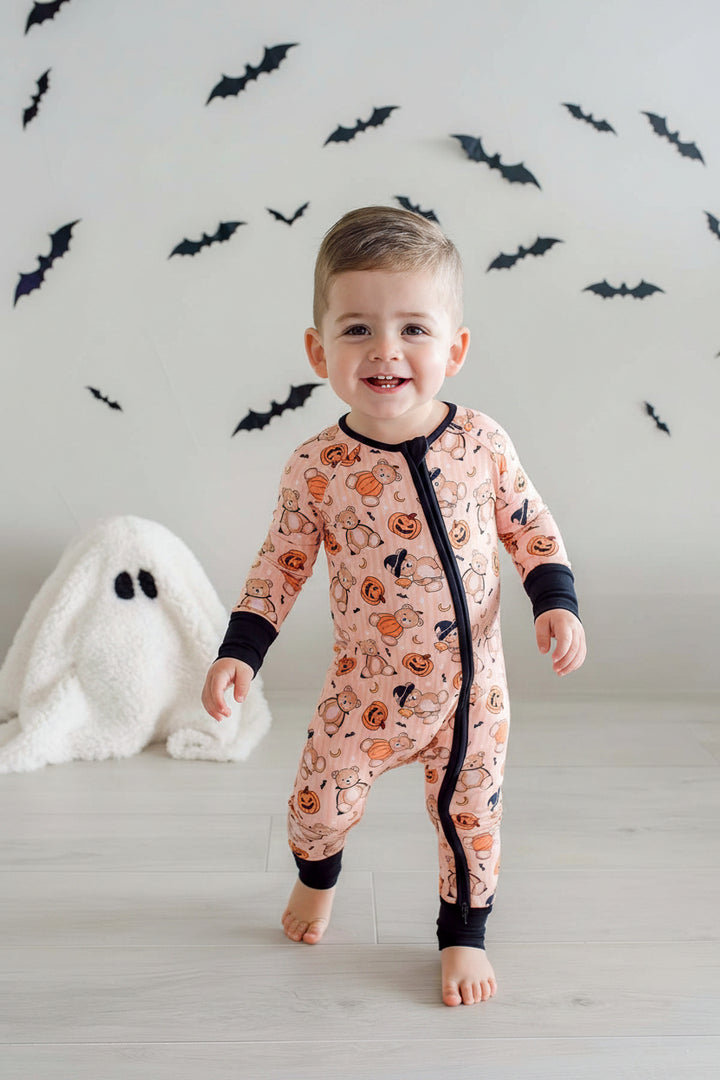 smiling boy in beary scary halloween convertible zip romper 