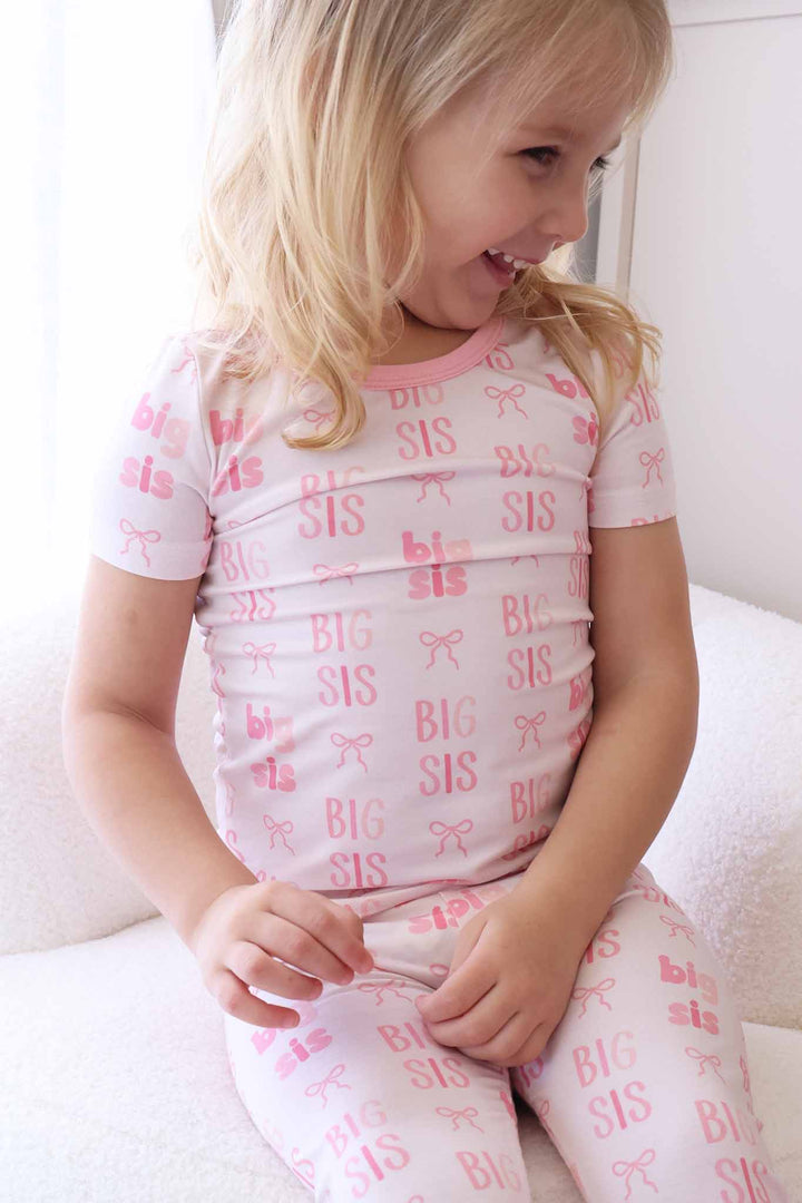 closeup of big sis bow short sleeve pajama set pink