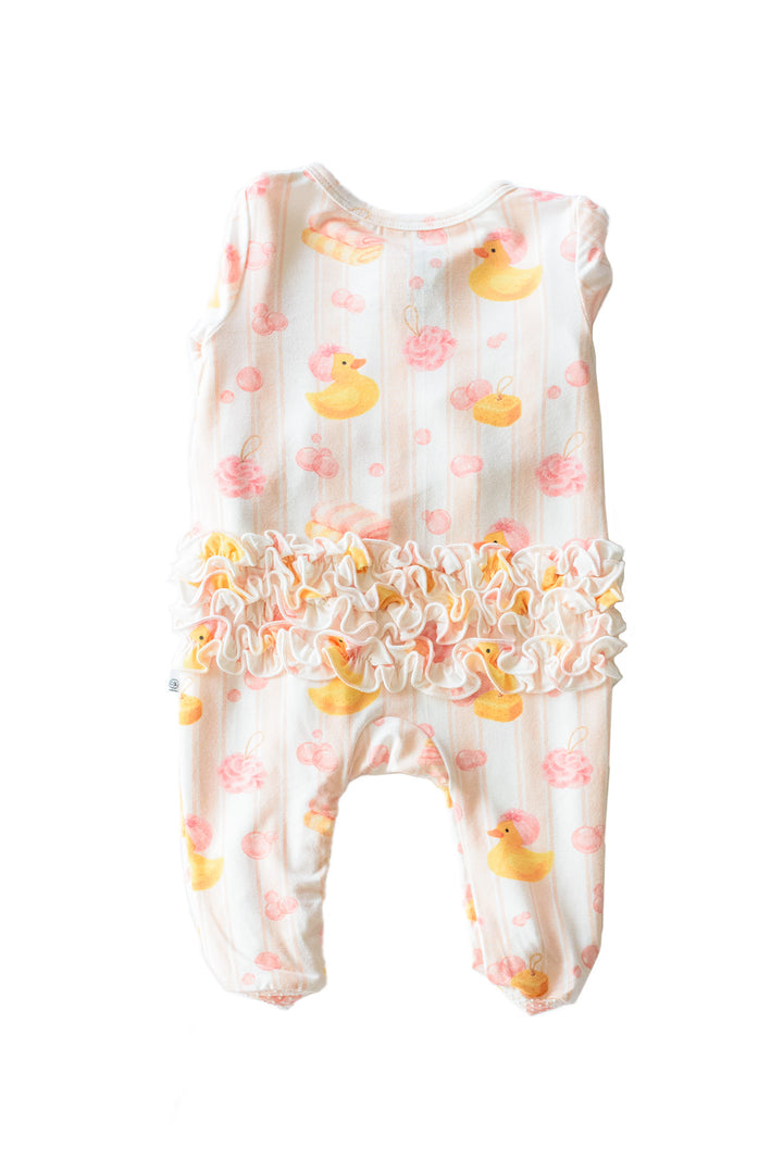 Back view of pink Bubble Duckies ruffle bamboo footie showing multi-tier ruffle waist detail and yellow duck print