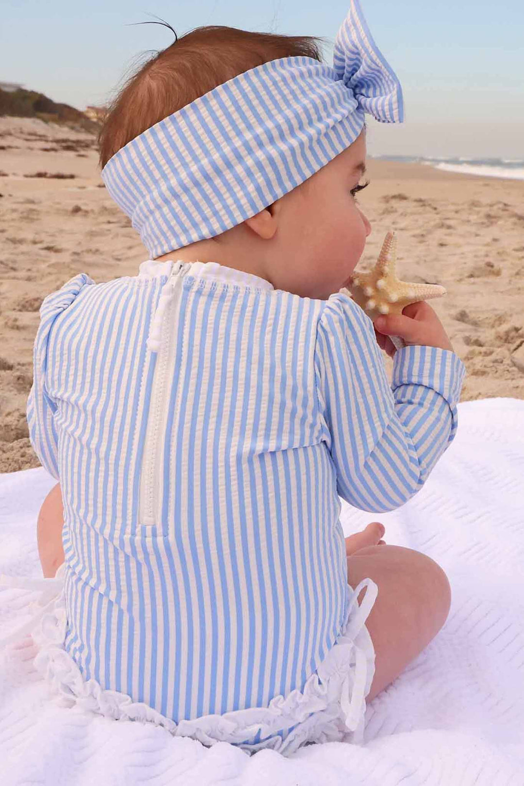 blue seersucker ruffle butt rash guard 