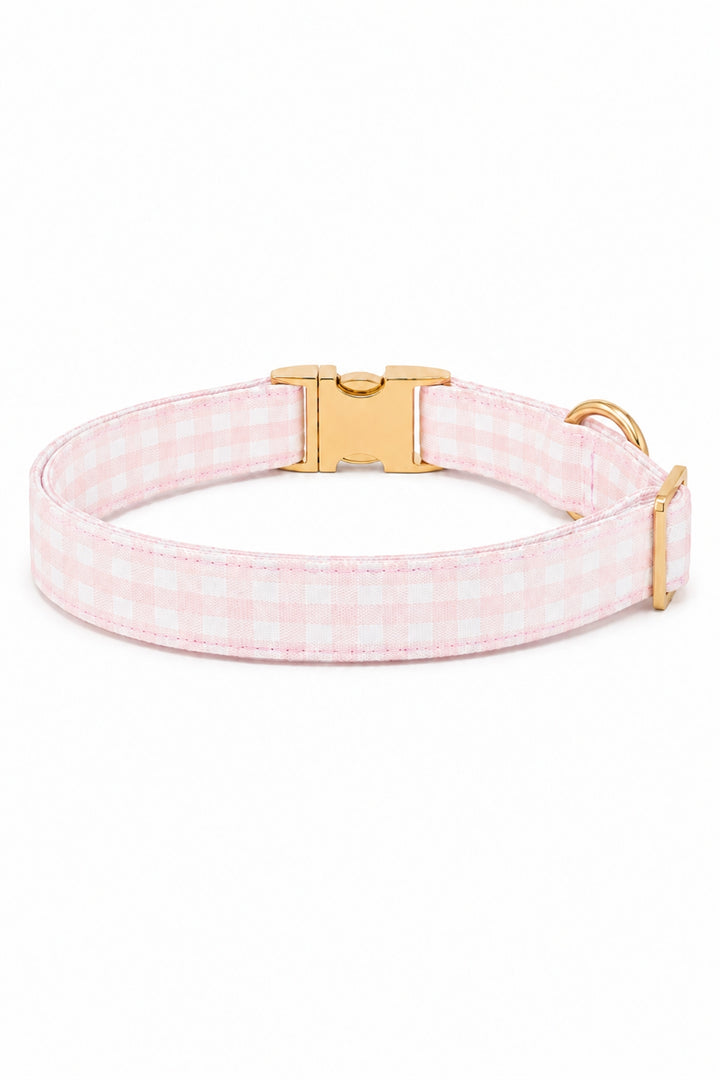A Lane & Leash pink and white gingham check dog collar with a gold-tone buckle, shown on a clean white background.