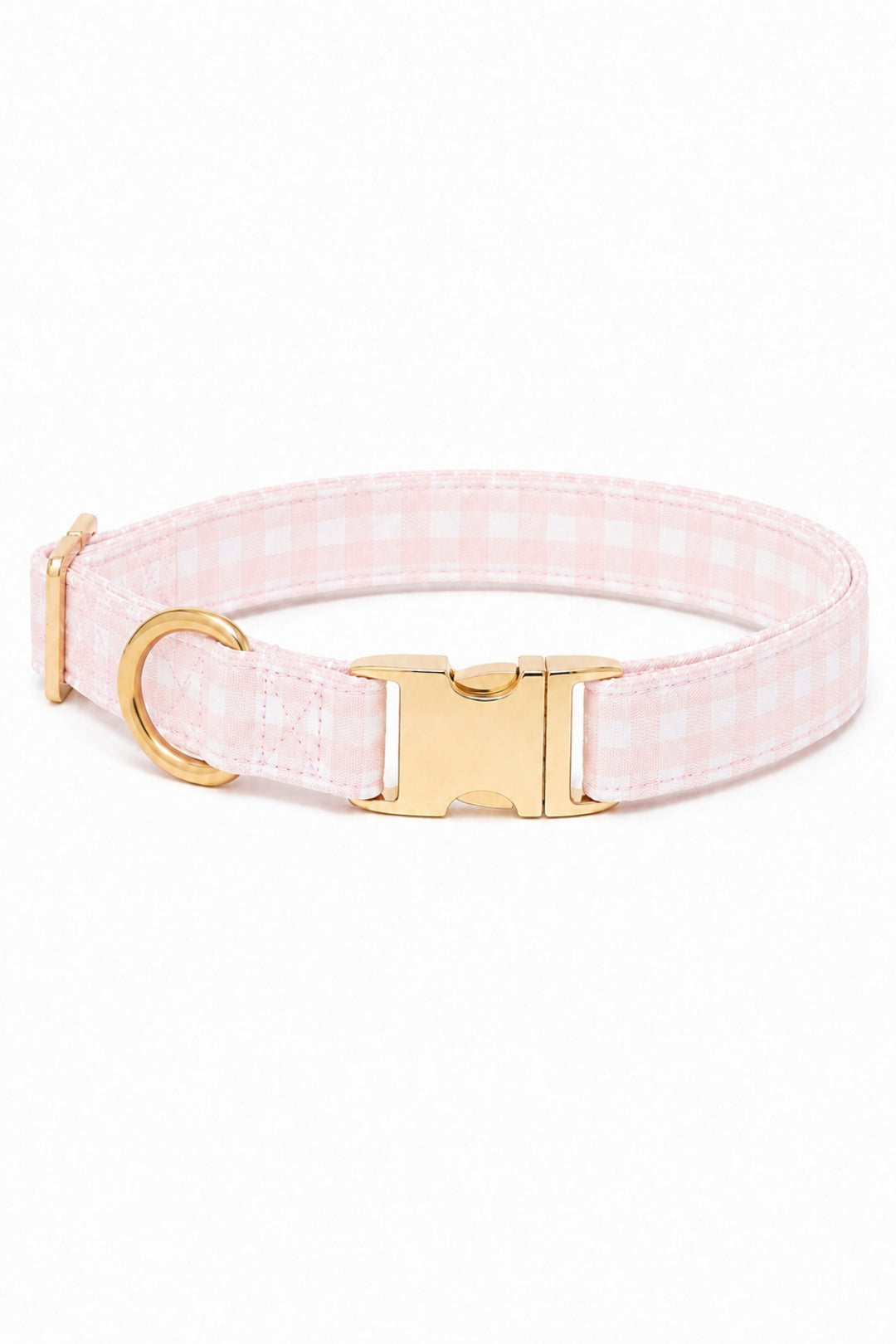 A Lane & Leash light pink and white gingham check dog collar with gold-tone hardware, including a buckle, D-ring, and adjustment slider, shown on a plain white background.
