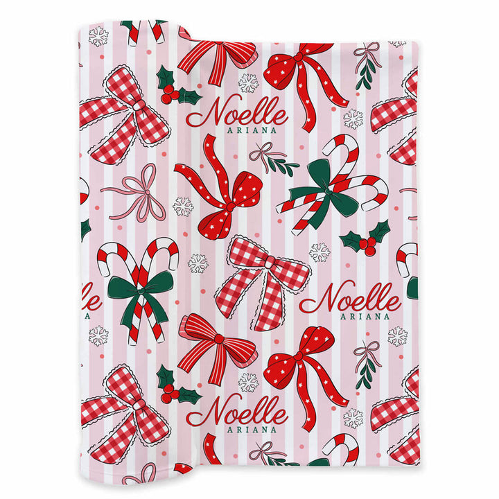 red bow and candy cane with pink and white stripe personalized swaddle blanket for newborns 