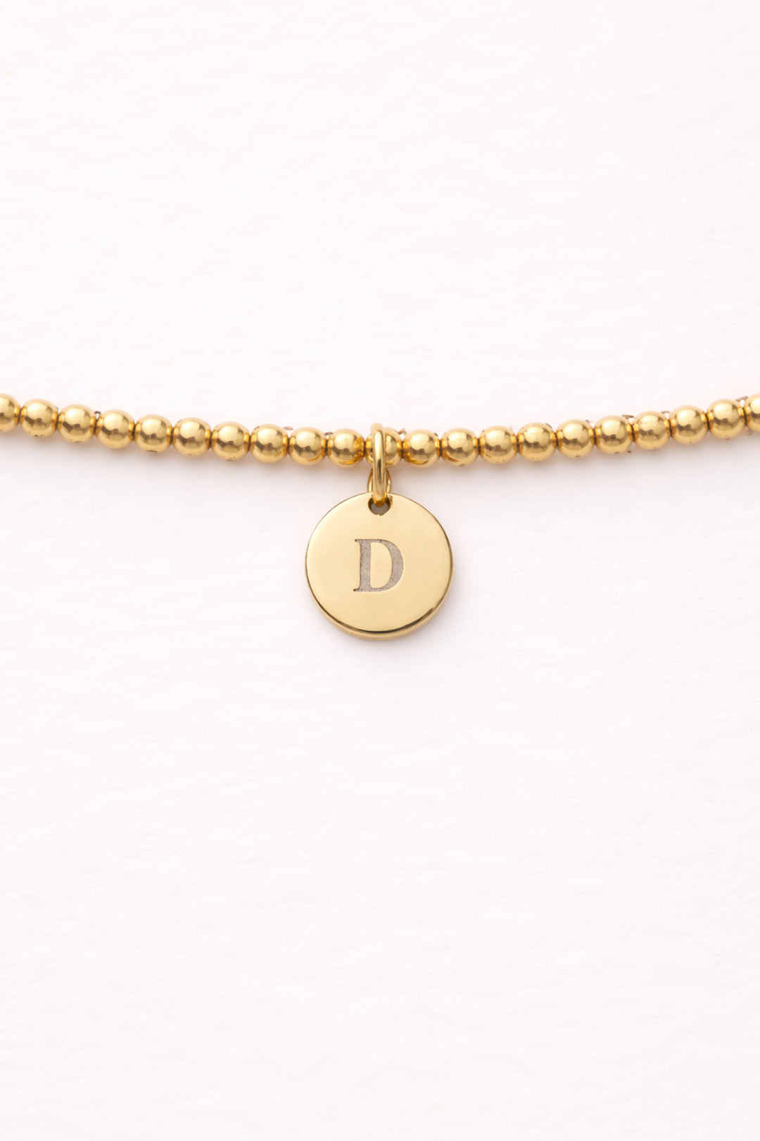 engraved circle charm beaded bracelet