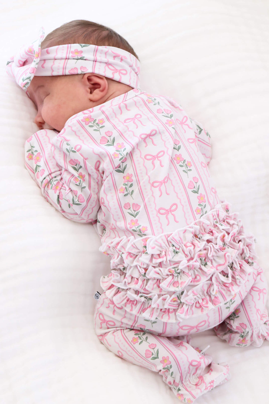bamboo baby ruffle zipper footie with coquette garden bow and floral details