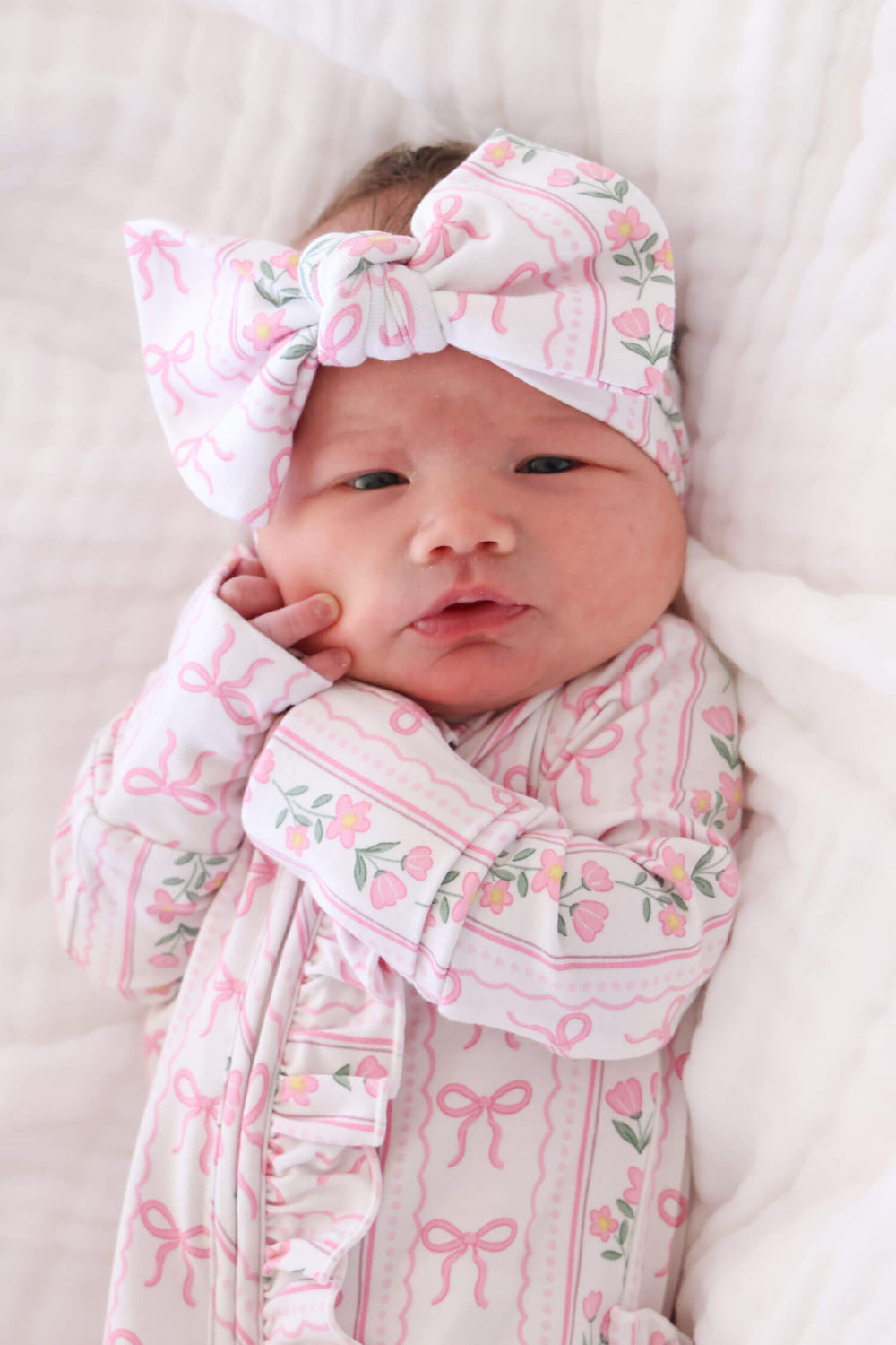 caden lane ruffle zipper footie in coquette garden floral print for newborns