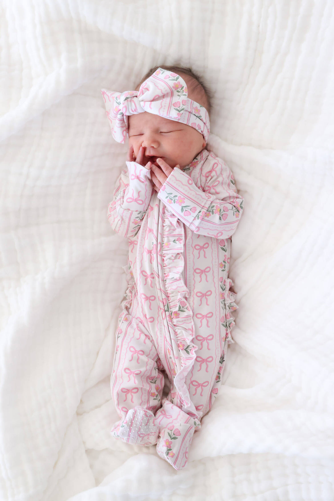 caden lane ruffle zipper footie coquette garden print - bows and flowers for babies