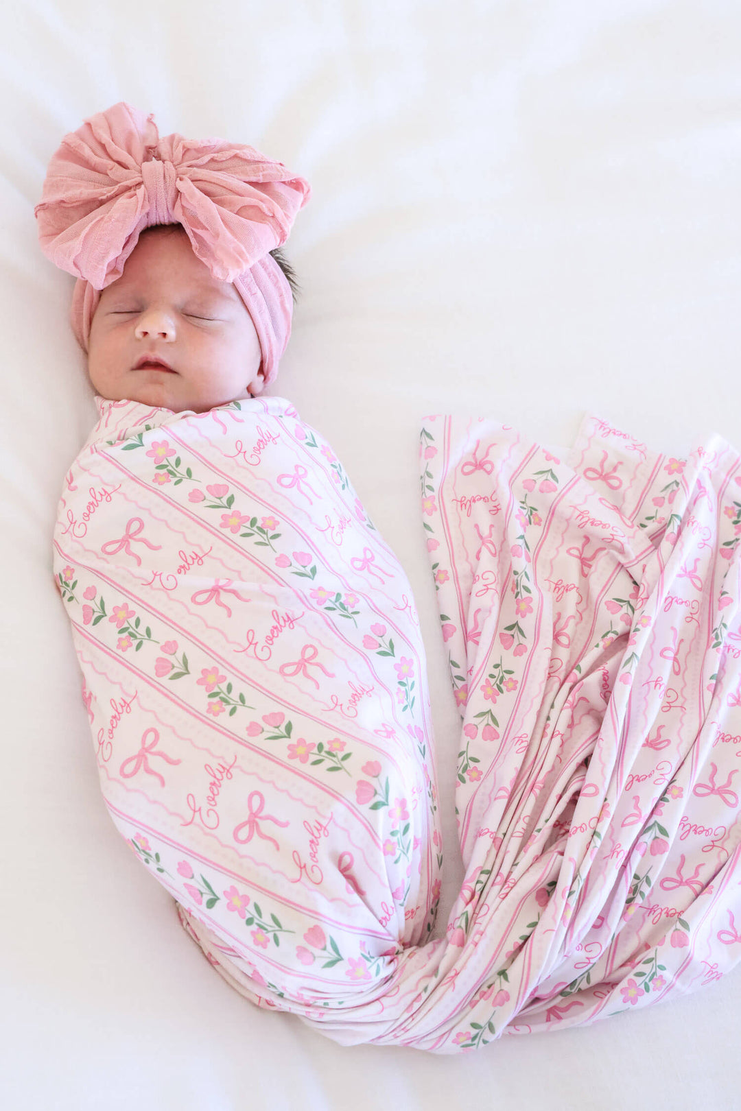 personalized swaddle blanket featuring coquette garden bow and floral print