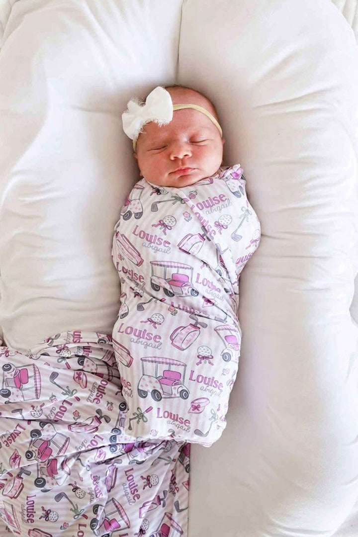 golf personalized swaddle blanket in pink, caddie crew, flat lay