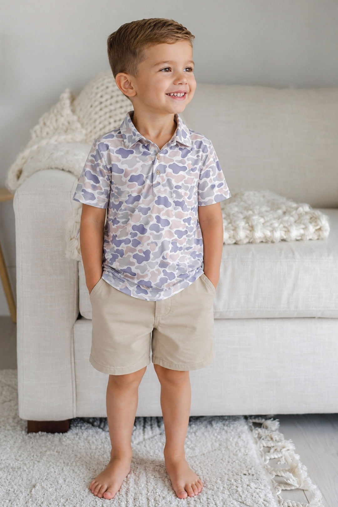 Little boy wearing the Camo Cutie Kids Short Sleeve Polo