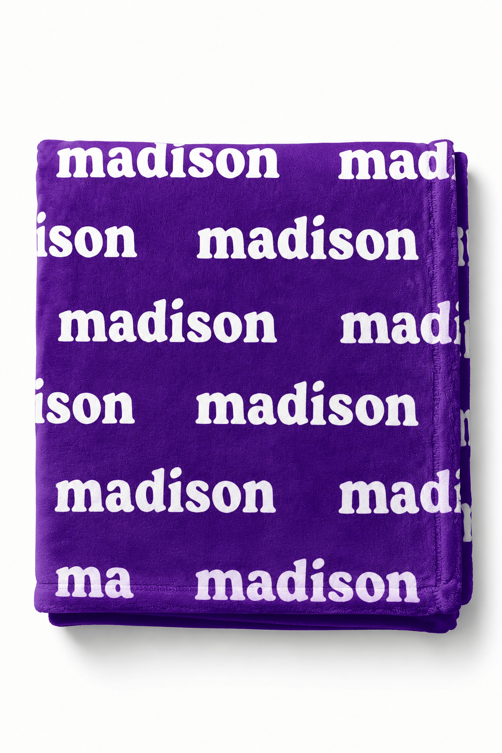A folded purple fleece blanket featuring a repeating white 'madison' text pattern, shown against a plain white background.