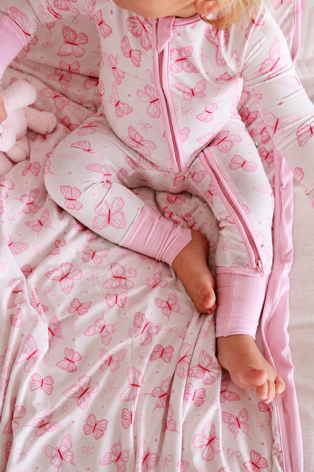 top view of blooming butterflies convertible zip romper